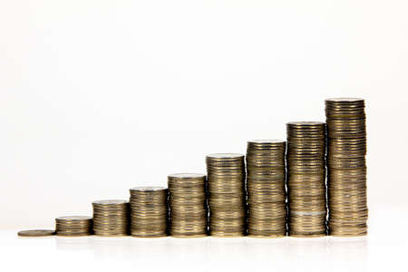 Money,Financial, Business Growth concept Savings, increasing columns of coins on isolated white background .の写真素材