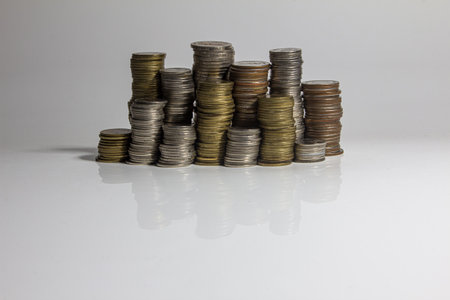 Money,Financial, Business Growth concept Savings, increasing columns of coins on isolated white background .の写真素材