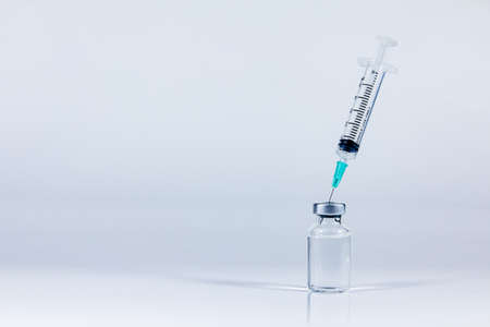 Syringe and vaccine bottle on white background. healthcare and hospital.の写真素材