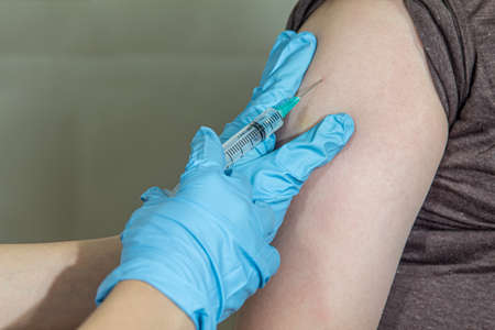 Close up of hands  are vaccinations to patients using the syringe.の写真素材