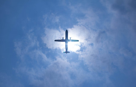 Airplane in the blue sky with white clouds, travel concept.の写真素材
