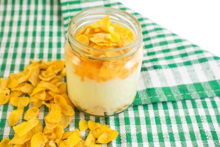 Cornflakes with yogurt is diet food.の写真素材