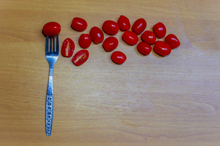 Red tomato with fork.の写真素材