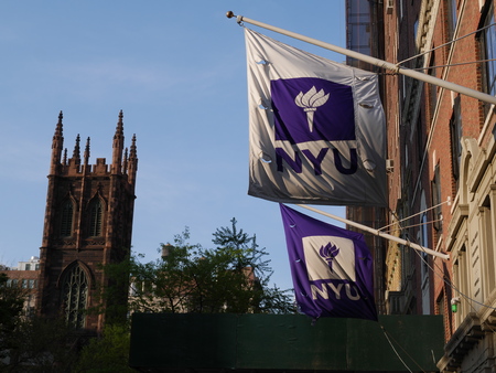 New York City - April 29 2017. New York University flags outside of building.のeditorial素材