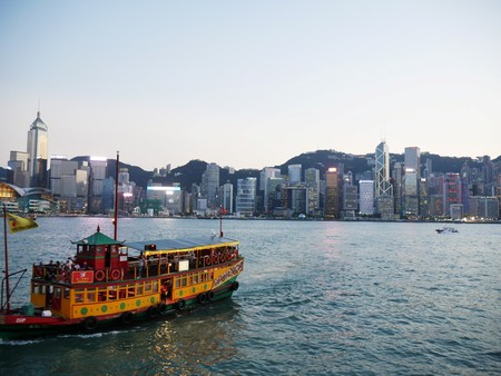 Hongkong - October 11, 2017 - Hongkong CBD skyline at twilight with chinese boat in foreground