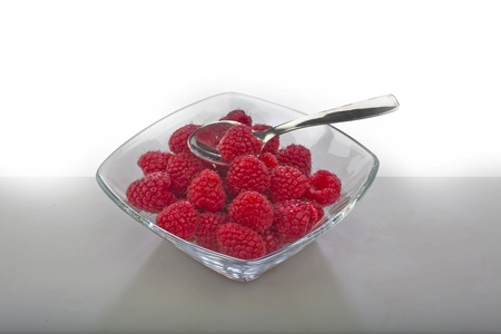 Raspberries with spoon; studio photography  