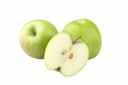 closeup studio shot of two green apples and half cut showing seeds isolated on white background clipping path includedの写真素材