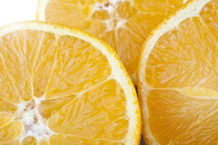 studio macro shot of three ripe juicy slices of orange の写真素材