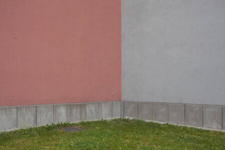 corner of building with pink and grey wallの写真素材