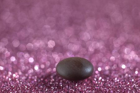 Macro Photo Of Pill of Vitamin B12 on Pink Bokeh