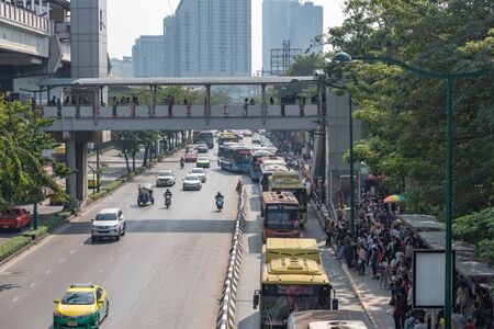 Photos on the flyover, Traffic jam on the street around Moh - Chit BTS station and bus stop People...