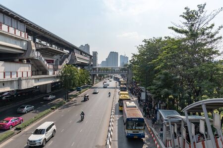 Photos on the flyover, Traffic jam on the street around Moh - Chit BTS station and bus stop People are waiting for the bus.のeditorial素材