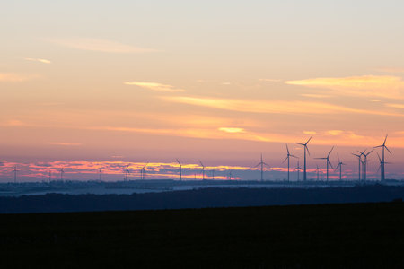 An image of wind turbines in the field at sunset, Naumburg, Germany