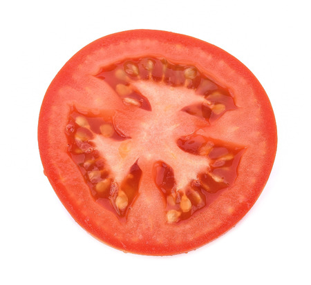 Tomato slice isolated on white backgroundの写真素材