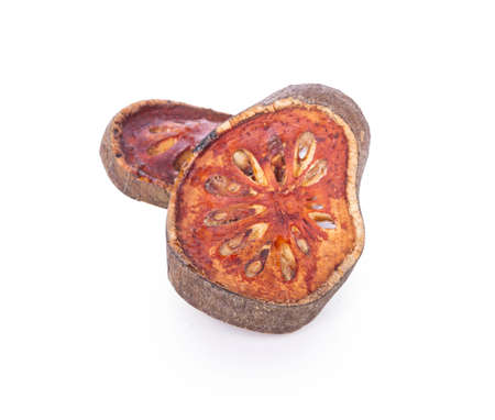 Dried sliced Bael fruit isolated on white background.の写真素材