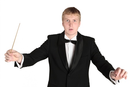 Conductor standing with baton in hand