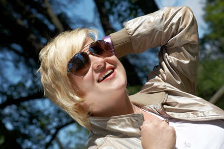 Young woman in sunglasses under crownの写真素材