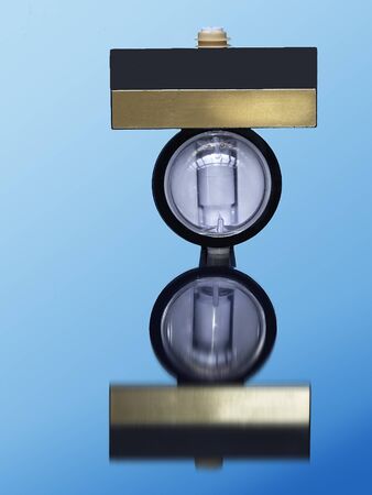 Optical dispencer for beverages on blue background