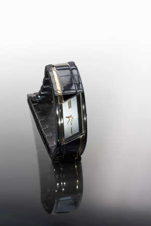 Ladie`s watch with white face on bracelet