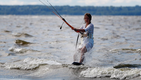 Kite surfer girl on wave portrait closeupの写真素材