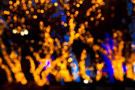Abstract christmas bokeh lights as background on black の写真素材