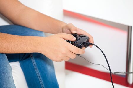 Video game controller in man hands