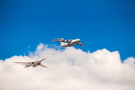 MOSCOW, RUSSIA - MAY 7, 2016: Avia parade in Moscow. The Ilyushin Il-78 is a Soviet four-engined aerial refuelling tanker and Tupolev Tu-160 White Swan is a supersonic, variable-sweep wing heavy strategic bomber on parade in Moscow, Russiaのeditorial素材