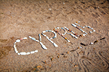 Sign Cyprus made from stones on the beach sandの写真素材