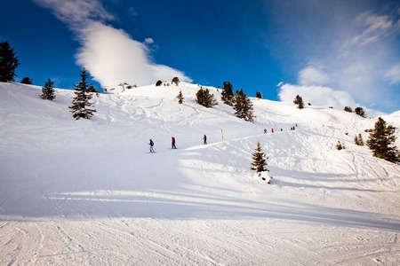 Ski resort in the Alps. Panoramic view of the mountains. People skiing and snowboarding. Mayerhofen, Austriaの写真素材