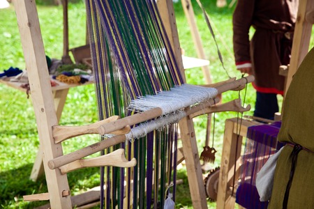 Manual weaving loom machine in ancient timesの写真素材