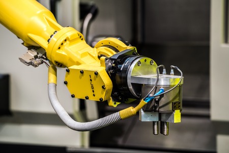 Industrial robot with CNC machine. Metal processing industryの写真素材