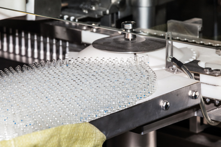 Ampoule filling and sealing machine