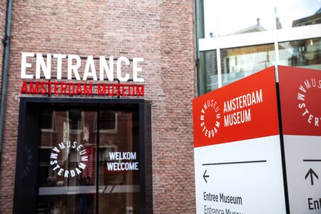 Entrance sign on the wall in Amsterdam museum