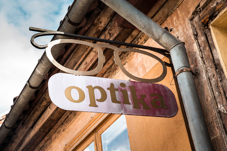 Wooden retro vintage Optika sign on the building wallの写真素材