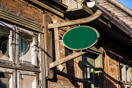 Wooden retro vintage sign on the building wallの写真素材