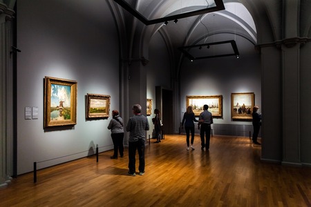 Visitors watching painting in Rijsmuseum in Amsterdam city, Hollandのeditorial素材