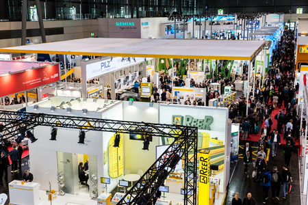 Visitors in exhibition stands and booths on Messe fair in Hannover, Germanyのeditorial素材