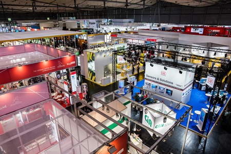 Visitors in exhibition stands and booths on Messe fair in Hannover, Germanyのeditorial素材