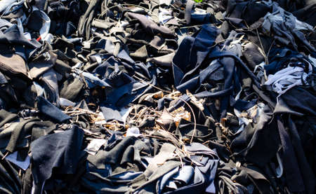 Trash that is a piece of cloth, old cloth is thrown away along the way. Waste that is difficult to degrade And cause pollutionの写真素材