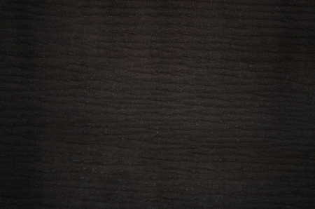 Old texture background close-up, black wall in resin. Soft focus. Texture of the old ruberoid
