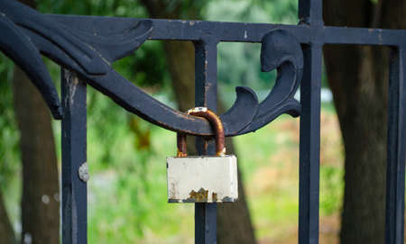 White Lock on the fence of the bridge. Lovers lock their love with the lock. Copy space