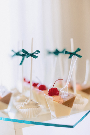 sweet festive buffet, fruit, caps, macaroni and lots of sweets well decoratedの写真素材
