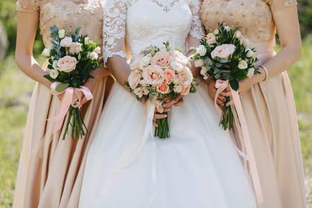 the bride holds a wedding bouquet in her hands, wedding day flowersの写真素材