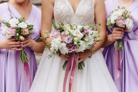 the bride holds a wedding bouquet in her hands, wedding day flowersの写真素材