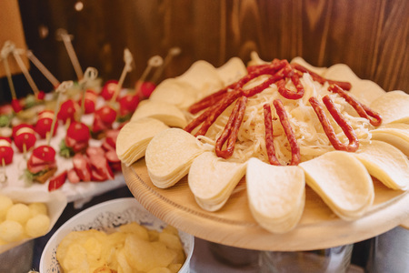 festive salty buffet, fish, meat, chips, cheese balls and other specialties for celebrating weddings and other events well decoratedの写真素材