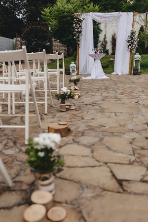 wedding ceremony decoration, chairs, arches, flowers and various festive decorの写真素材