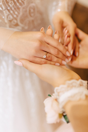 engagement ring with a stone on the gentle bride's hand, wedding tendernessの写真素材