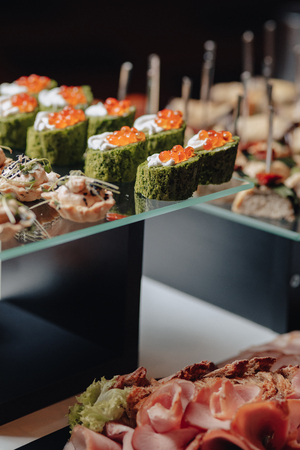 delicious festive buffet with canapÃ©s and different delicious meals salted and sweetの写真素材