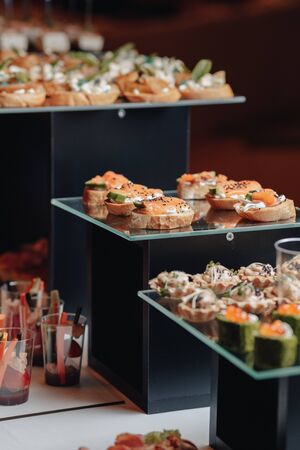 delicious festive buffet with canapÃ©s and different delicious meals salted and sweet