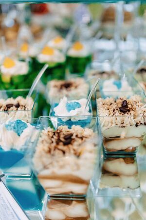 sweet festive buffet, fruit, caps, macaroni and lots of sweets well decoratedの写真素材